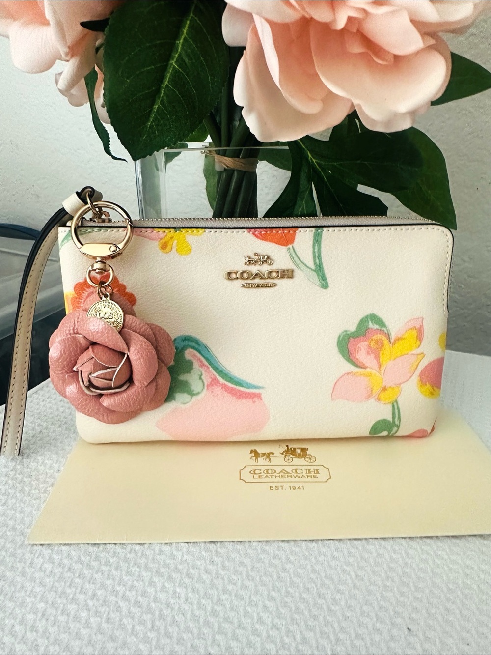 COACH Cream Floral Leather Wristlet with Pink Rose Charm